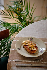 French toast with caramel and banana slices. Side view. Breakfast