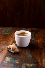 Cup of coffee on rustic wooden background. Soft focus. Copy space	