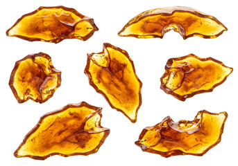 Naklejka premium Amber resin pieces transparent background golden yellow brownish color