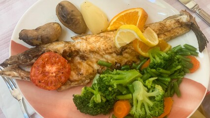 Grilled fish symphony with citrus crescendos, broccoli overture, solstice seafood festivity, and rustic roots celebrating lunar gastronomy