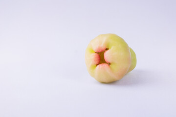 Fresh tropical water guava fruit with light green and pink skin isolated on white background, organic and juicy produce for healthy diet, nutrition, and natural food concept