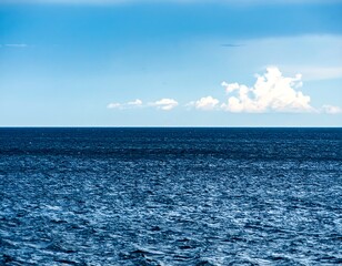 Tranquil ocean meets a vast sky