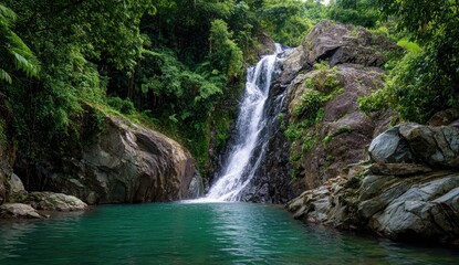 Obraz premium Lush waterfall cascading into a tranquil pool (13)