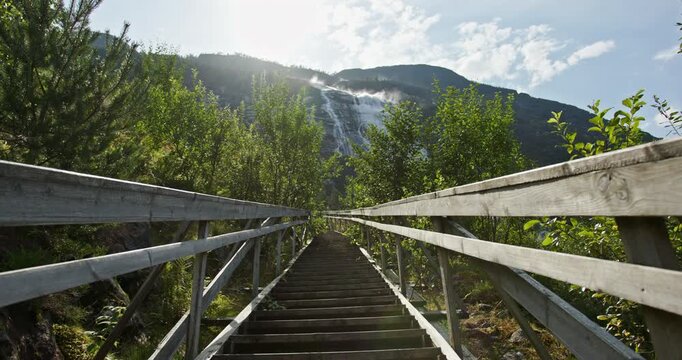 langfossen waterfall, norway &mdash; wooden boardwalk stairs leading to the cascade at &aring;krafjorden, etne, vestland