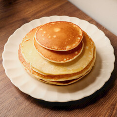Stack of pancakes on a plate.