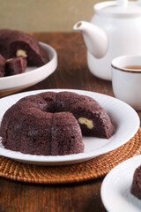 black sticky rice cake filled with cheese it called bolu ketan hitam keju lumer. Indonesian food. 
