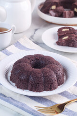 black sticky rice cake filled with cheese it called bolu ketan hitam keju lumer. Indonesian food. 
