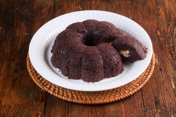 black sticky rice cake filled with cheese it called bolu ketan hitam keju lumer. Indonesian food. 
