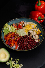 poke bowl with vegetables and chicken