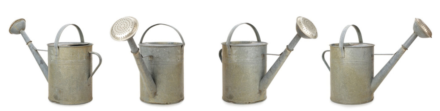 Set of vintage watering cans isolated on white background