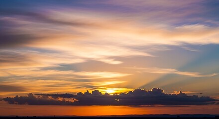 Dramatic Colorful Sunset Sky Over the Ocean with a Mountain Silhouette.