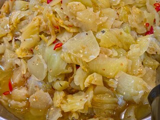 Close-up of pickled mustard greens. Famous Asian cuisine from China, Thailand and Vietnam.