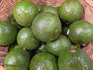Avocados Booth 7 in a basket, top view.