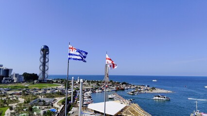 Drone Photo of Georgian Flag, Adjara Flag and Alphabet Tower from Batumi Port