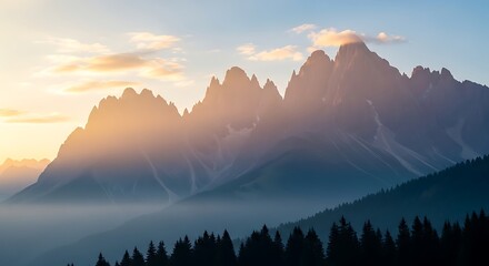 Majestic mountain range silhouetted against a pastel sky at sunrise, misty valleys below