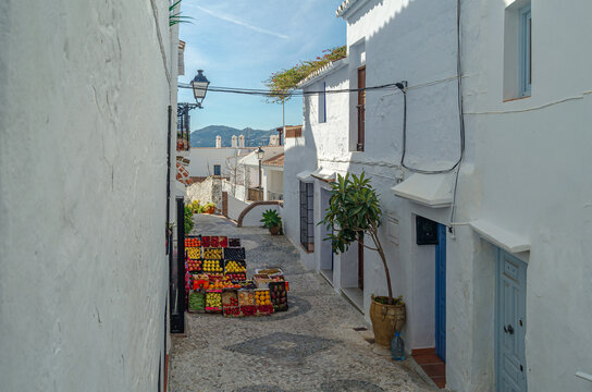 Fototapeta Streets in Frigiliana, typical Andalusian village with white houses, Spain