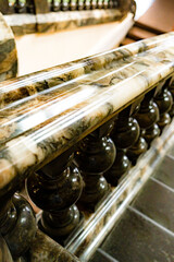ancient vintage marmoreal marble stairs with balusters in daylight