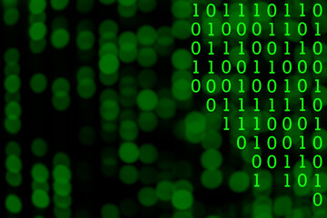 Green binary number system on blurred soft bokeh from LED lighting. Background for digital data transformation or Sci-Fi mystery concept.