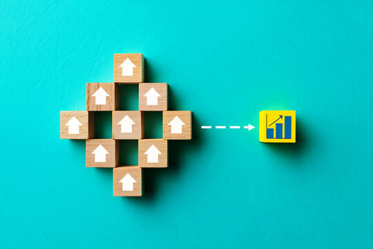 Wooden blocks with upward arrows forming a cluster pointing towards a yellow block with a bar graph symbol