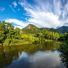 Fototapeta premium Serene river landscape under a vibrant sky (1)