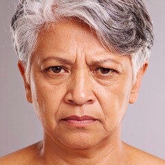 Close-up portrait of a woman with a serious expression