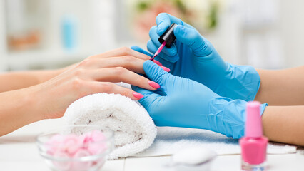 Professional manicure session with nail polish application, highlighting beauty care, hygiene, and salon aesthetics in close-up detail. AI generated.