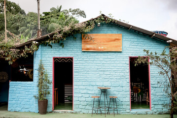 Colorful Rustic Caf&eacute; with Blue Brick Walls and Outdoor Seating