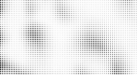 Abstract halftone pattern with varying density of black dots fading into a white background, creating a textured effect.