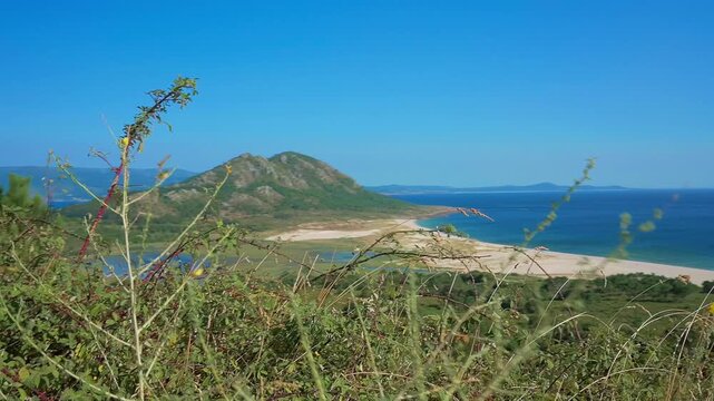 Wide view of Monte Louro, the beach and coastal lagoon near Muros, Galicia, Spain, on a sunny day