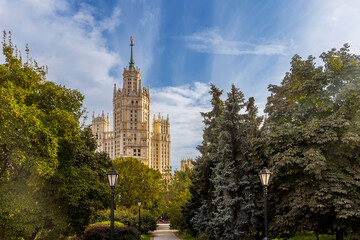 Moscow, Russia, August 25, 2025, Stalin's skyscraper on Kotelnicheskaya embankment. View through the green park