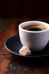 Cup of coffee on rustic wooden background. Soft focus. Copy space	