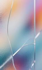 Ethereal abstract background featuring iridescent light refractions on a glass surface with a soft, blurred pastel color gradient