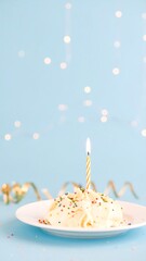 Small birthday cake on a plate with a candle