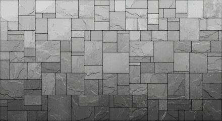 A wall covered in various sized gray stone tiles creating a textured gradient pattern.