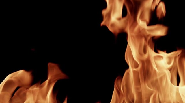 Fire flames burning overlay isolated on black background video footage in 4K.