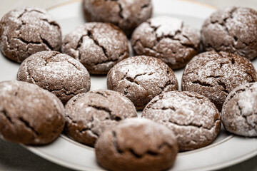 Chocolate Cookies with Cream Cheese and Powdered Sugar on Plate