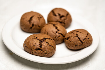 Tasty Chocolate Cookies with Cream Cheese Layer on Plate