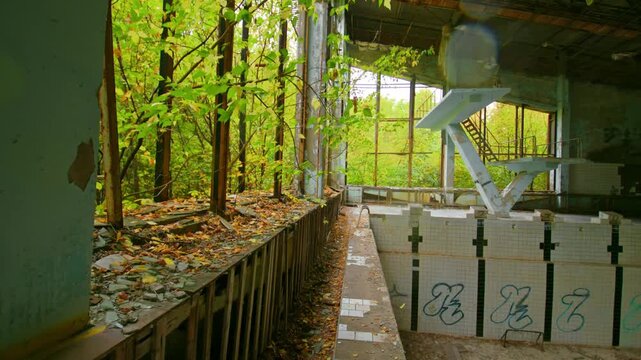 Eerie and atmospheric footage captures the decaying beauty of the abandoned Lazurni Swimming Pool in Pripyat, Ukraine, located within the Chernobyl Exclusion Zone.