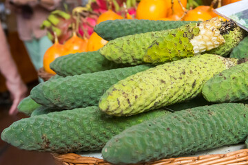 Delicious exotic fruits of Monstera deliciosa (banana pineapple, banana ananas or ceriman) on traditional farmer market in Funchal, Madeira, Portugal