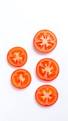 Fototapeta premium Tomato slices arranged on white background
