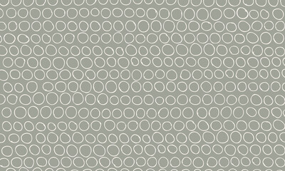 Abstract doodle background of random hand drawn circles in soft colors