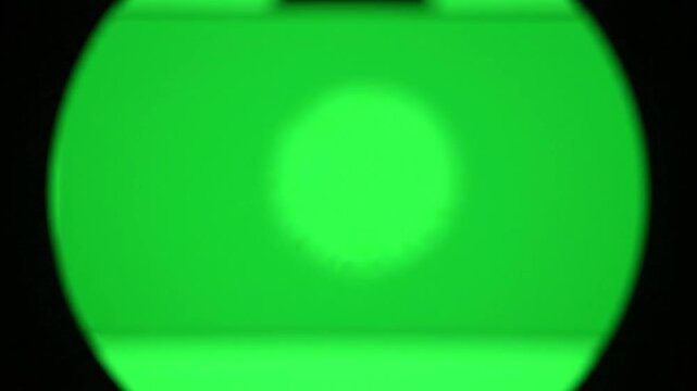 close view on microscope on green screen  
