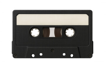 Naklejka premium Vintage black audio cassette lying on clear surface, empty label highlighting retro music storage media with minimalist design aesthetic
