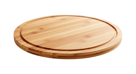 Round wooden cutting board with grooves on a black background