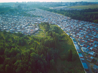 Aerial view landscape with garage roofs and trees