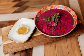 Luxury foie gras pâté on wooden board. Gourmet French delicacy served with herbs.