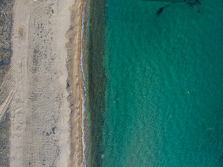 Aerial top down of wrecked boat Mediterranean Sea shipwreck beach Thessaloniki