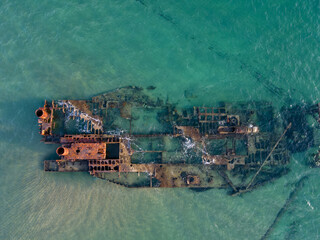 Aerial top down of wrecked boat Mediterranean Sea shipwreck beach Thessaloniki