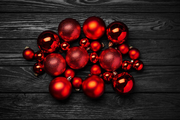 red christmas balls on dark wooden table christmas and new year concept