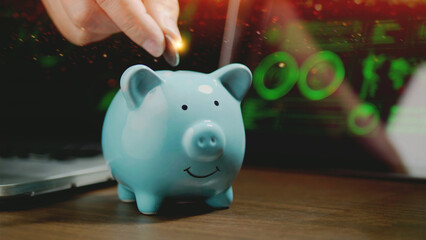 Saving money in a piggy bank, financial planning and good investment goals